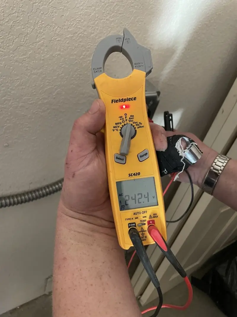 Voltage testing with clamp meter during Recessed Lighting Installation in Monongahela